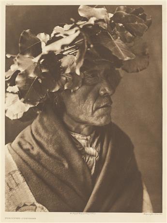 EDWARD S. CURTIS (1868-1952) Self-portrait in felt hat.